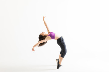 Naklejka premium Jazz Dancer On Tiptoes Bending Backward On White Background