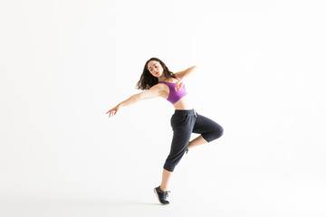 Naklejka premium Beautiful Modern Ballet Dancer Rehearsing Her Dance Moves