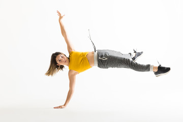Portrait Of Young Female Break Dancer Doing Handstand