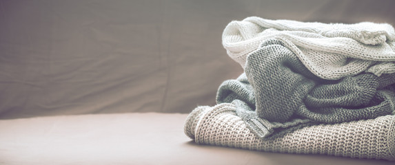 knitted sweaters on the couch in the living room