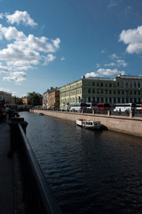 Saint-Petersburg, Russia, August 2018: View of the Griboedov Canal embankment with tourist boat near Famous Kazan Cathedral in the centre city. Tourism concept. Editorial use only.