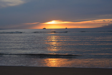 Sunset over the Pacific from Baby Beach in Lahaina, Maui.