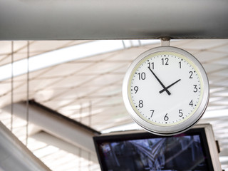 The big wall clock in the subway for passenger looking the time at subway platform.