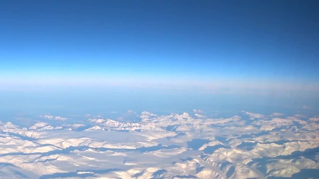 Aerial view over the snowy mountains of Northern Norway