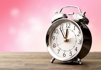 Retro alarm clock on   background