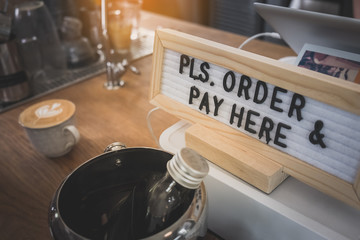 order & pay here box sign