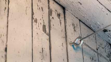 old wall of boards with peeling paint