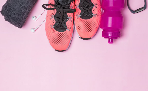 Fitness accessories like sneakers, bottle with water and other