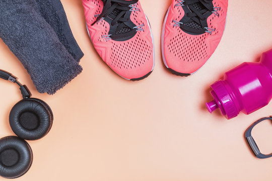 Fitness accessories like sneakers, bottle with water and other