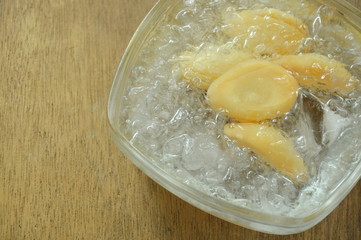 salacca tropical fruit seedless in syrup and ice on glass bowl