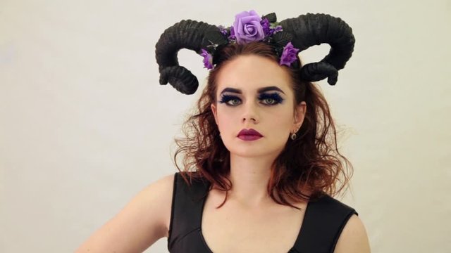 girl in a fairy-tale image with horns on her head