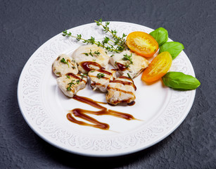 Fototapeta na wymiar Dietary dish - chicken breast with herbs and vegetables