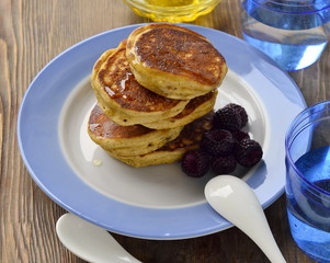 Corn flour pancakes with berries and honey
