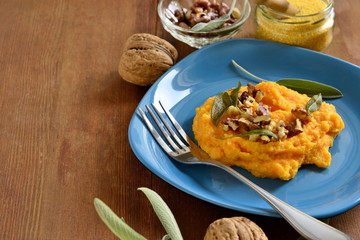 Corn porridge / polenta / with roasted carrots, walnuts and sage,  copy space