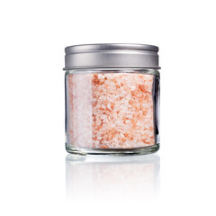 pink himalaya salt in a glas with metal lid, isolated on white