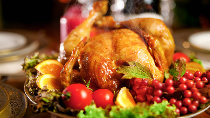 Closuep image of hot fresh baked chicken on festive dinner table