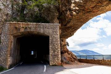 empty road and tunnel in mountains in provence, france