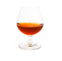 Wineglass with cognac isolated on white background - obrazy, fototapety, plakaty
