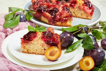 Delicious sponge cake with caramelized plums. Sweet autumn dessert