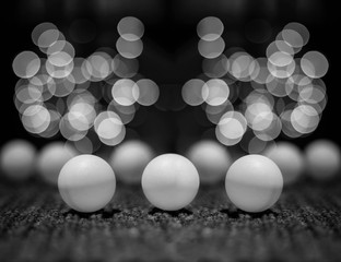 Bokeh background black and white.