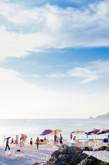 Phuket vibrant Patong beach with colourful umbrellas in evening