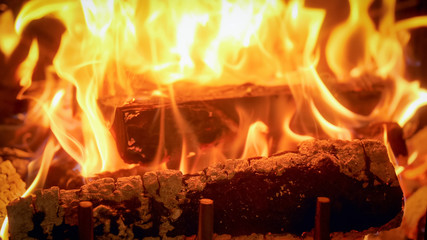 Closeup image of beautiful fire flames in firepalce