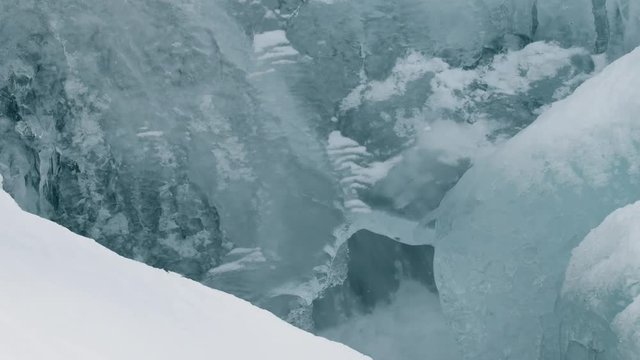Water flowing under an ice sheet in a frozen creek