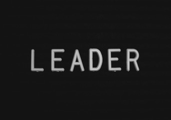 Word leader written on the letter board. White letters on the black background
