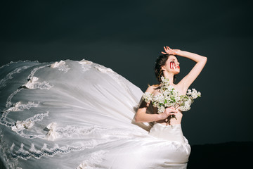 violence and cruelty. bloody tears on face of halloween woman in wedding dress. violence and...