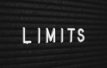 Word limits written on the letter board. White letters on the black background