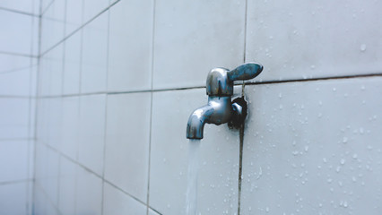 Close-up shot of pipe water in Ablution area in mosque 