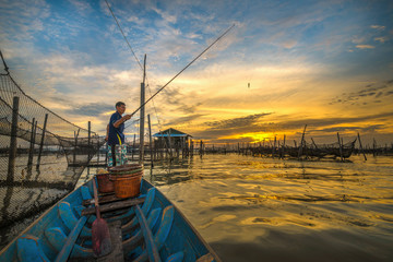 Traditional colorful asian fishing boats in fishing village