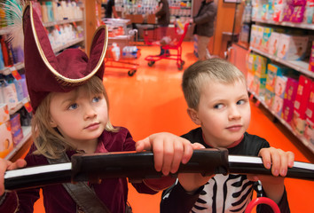 Boy and Girl in Costume in a Grocery Store