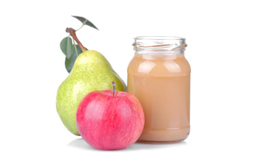 puree of pear and apple for children in a jar next to fresh fruit on white isolated background