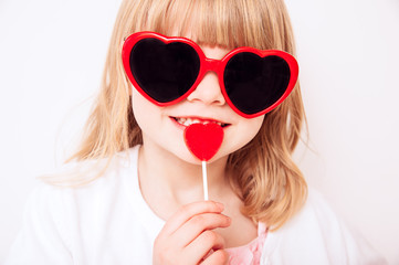 Girl with Heart Sunglasses and Lollipop