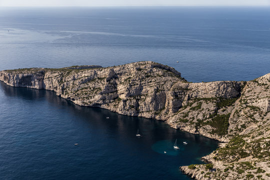 aerial view of scenic cliffs and yachts in harbour in Calanques de Marseille (Massif des Calanques), provence, france