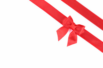 Red bow with ribbon isolated on white background