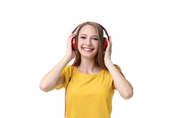 Young woman with headphones on white background