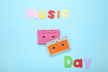 Cassette tapes with inscription Music Day on blue background