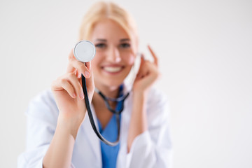 Doctor Woman holds stethoscope. Medical assistance or insurance concept The doctor is ready to check the patient and help. The concept of treatment and care for patients.