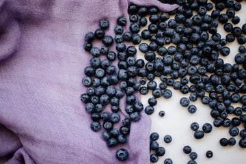 Blueberries on a white table.