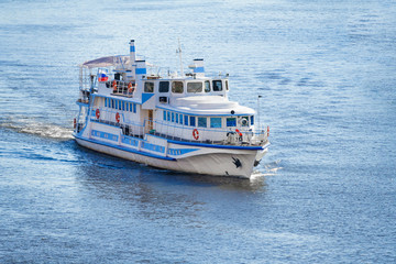 Aerial view on a small cruise ship on the blue water