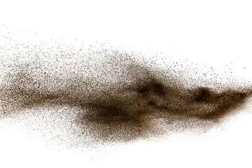 Deep Brown particles splattered on white background. Brown dust splash.