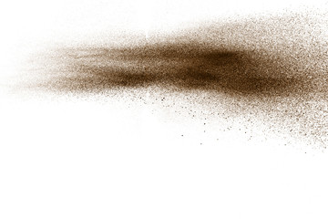 Fototapeta na wymiar Deep Brown particles splattered on white background. Brown dust splash.