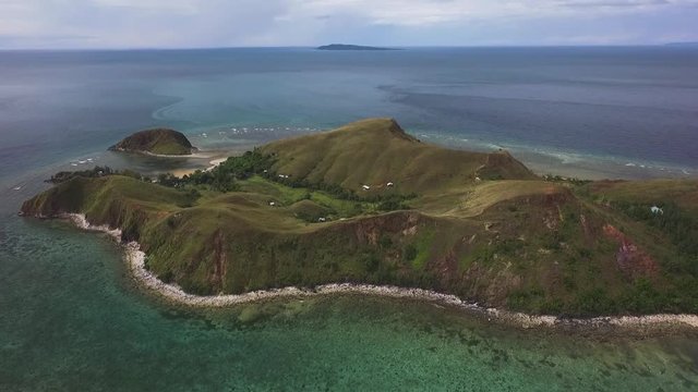 Drone view of Mararison tropical island, Philippines. Cloudy dramatic day.