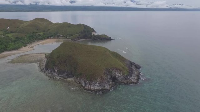 Aerial view of hills on Mararison tropical island, Philippines. Dramatic cloudy day.