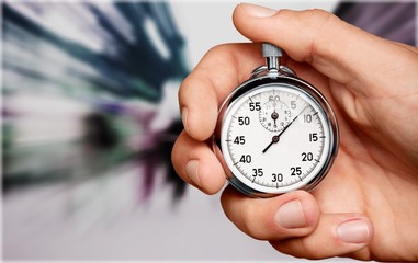 Stopwatch in Human Hand, close-up view