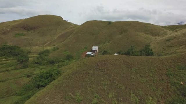Aerial view of hills on Mararison tropical island, Philippines. Dramatic cloudy day.