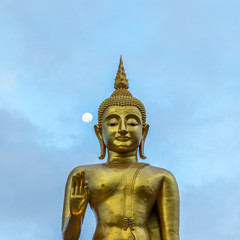 Fototapeta premium Buddha image statue at Hatyai public park, Songkhal with moon