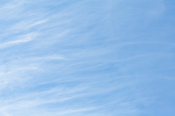 Abstract view of a white feather clouds in light blue sky as background